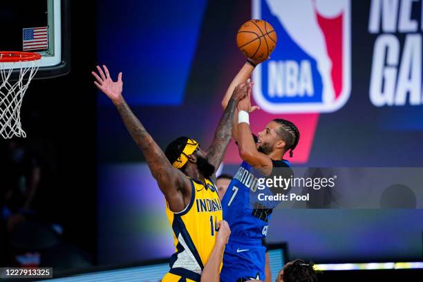 Michael Carter-Williams of the Orlando Magic shoots over JaKarr Sampson Indiana Pacers during the first half of an NBA basketball game on August 4,...