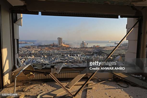 View shows the aftermath of yesterday's blast at the port of Lebanon's capital Beirut, on August 5, 2020. - Rescuers worked through the night after...