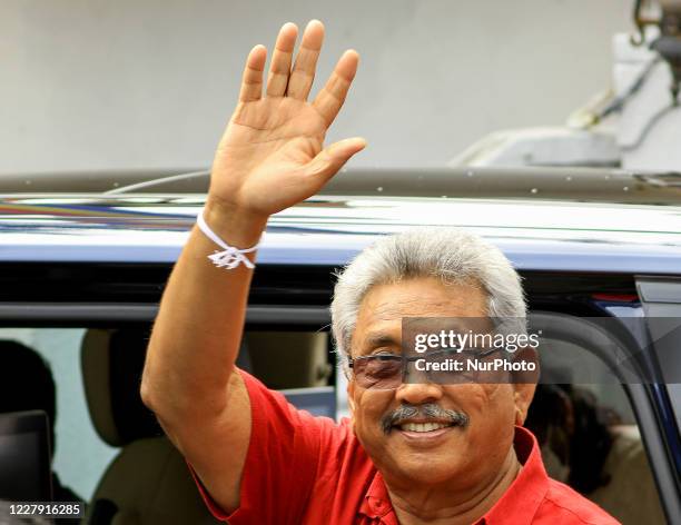 Sri Lankan president Gotabaya Rajapaksa gestures as he leaves after casting his vote for the parliamentary election at a polling station in Colombo,...