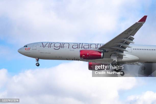 Virgin Atlantic Airbus A330-300 aircraft as seen flying for landing on final approach at London Heathrow LHR EGLL International Airport in England,...