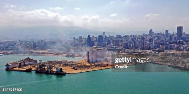 An aerial view shows the massive damage at Beirut port's grain silos and the area around it on August 5 one day after a massive explosion hit the...