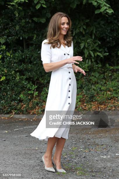 Britain's Catherine, Duchess of Cambridge reacts as she arrives to visit to Baby Basics baby bank in Sheffield, northern England on August 4, 2020. -...