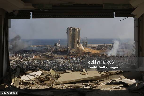 Smoke rises above wrecked buildings at the citys port, devastated by an explosion a day earlier, on August 5, 2020 in Beirut, Lebanon. As of...