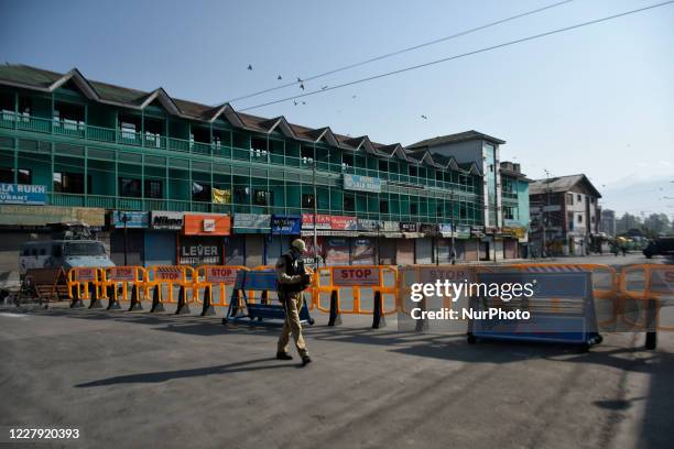 Indian paramillitary troopers stands alert during strict restrictions in Srinagar, Indian Administered Kashmir on 05 August 2020. Restrictions were...