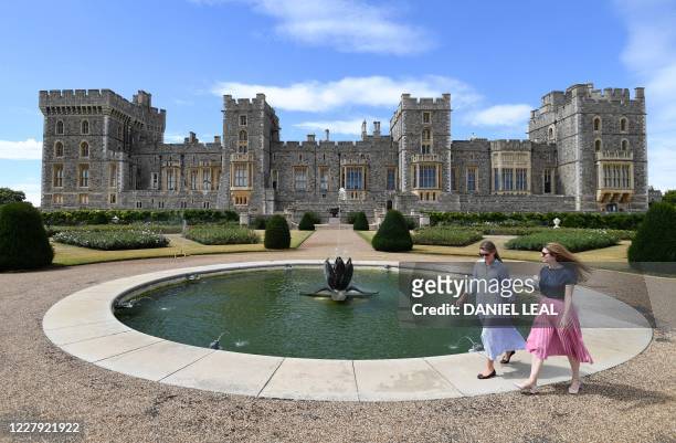 Castle employees pose during a photocall in the East Terrace Garden at Windsor Castle in Windsor on August 5, 2020. The East Terrace Garden at...