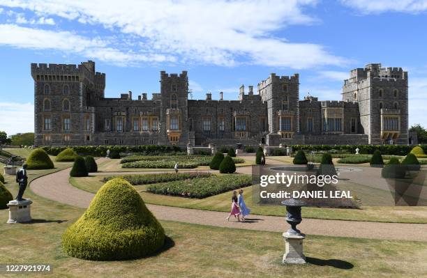 Gardener poses whilst pruning roses during a photocall in the East Terrace Garden at Windsor Castle in Windsor on August 5, 2020. The East Terrace...