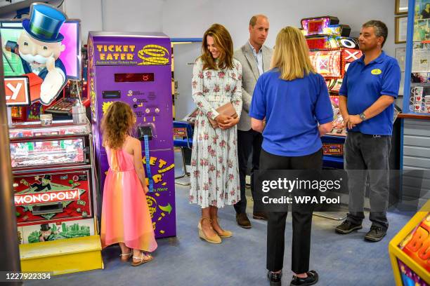 Catherine, Duchess of Cambridge as the Duchess talks to Erin Phillips at Island Leisure Amusement Arcade, where Gavin and Stacey was filmed, during...