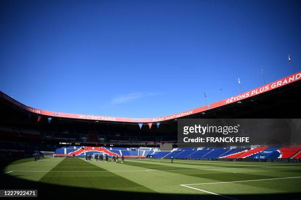 Sochaux's players walk on the pitch ahead of the French L1 pre-season friendly football match between Paris Saint-Germain and Sochaux at the Parc des...