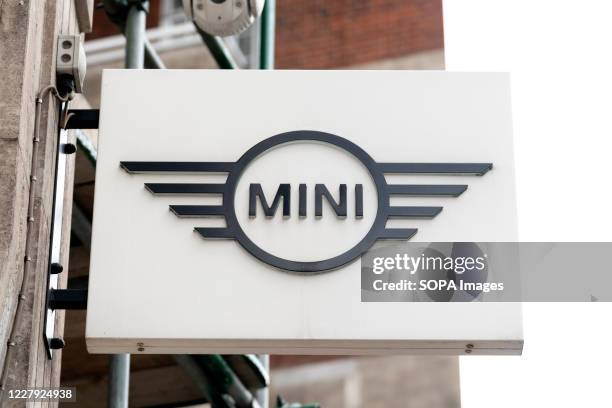 Mini company logo seen on one of their car dealerships showrooms in London.