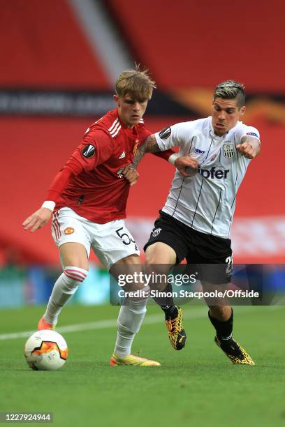 Brandon Williams of Man Utd and Dominik Frieser of LASK during the UEFA Europa League round of 16 second leg match between Manchester United and LASK...