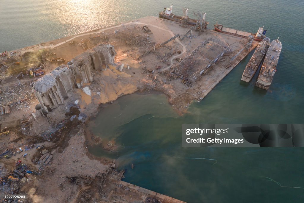 Port Disasters An aerial view of ruined structures at the port, damaged by an... News ...
