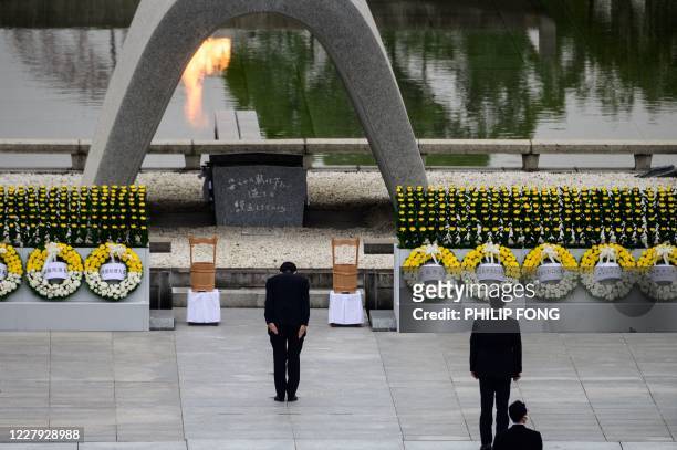 Japanese Prime Minister Shinzo Abe bows in front of the Memorial Cenotaph after delivering a speech during the 75th anniversary memorial service for...