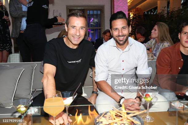 Kai Pflaume and soccer player Claudio Pizarro during the opening of H'ugo's restaurant on August 5, 2020 in Gruenwald near Munich, Germany.