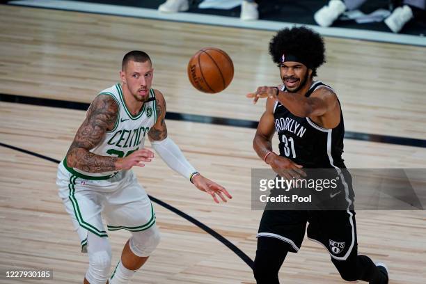 Jarrett Allen of the Brooklyn Nets passes around Daniel Theis of the Boston Celtics during the first half of an NBA basketball game at the ESPN Wide...