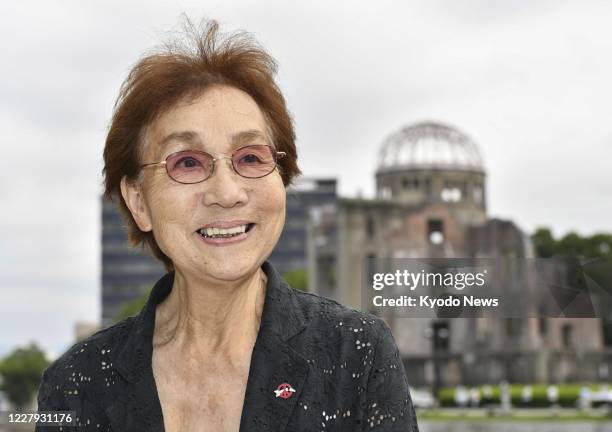 Emiko Okada, an 83-year-old survivor of the U.S. Atomic bombing of Hiroshima, is pictured against the background of the Atomic Bomb Dome in the...