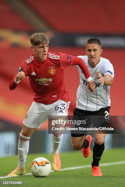 Brandon Williams of Man Utd battles with Reinhold Ranftl of LASK during the UEFA Europa League round of 16 second leg match between Manchester United...