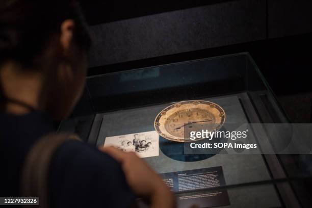 Visitor seen looking at a clock who stopped at exactly 8:15am, the time where the atomic bomb was dropped over Hiroshima city on August 06 at the...