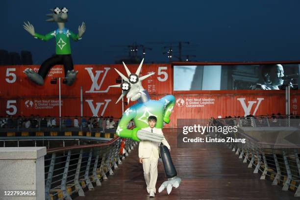 Singer Kris Wu walks the runway during the Louis Vuitton S/S21 Men's Collection show at Shanghai Tank Art Park on August 6, 2020 in Shanghai, China.