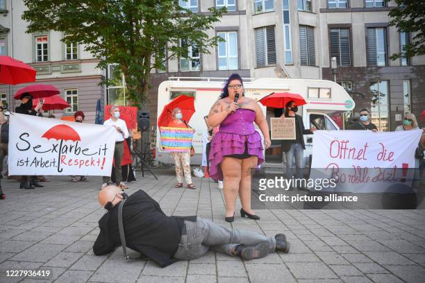 August 2020, Baden-Wuerttemberg, Stuttgart: A participant speaks during a demonstration on the ban on sex workers during the Corona pandemic. Since...