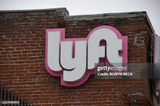 Rideshare drivers demonstrate against rideshare companies Uber and Lyft during a car caravan protest on August 6, 2020 in Los Angeles. - The drivers,...