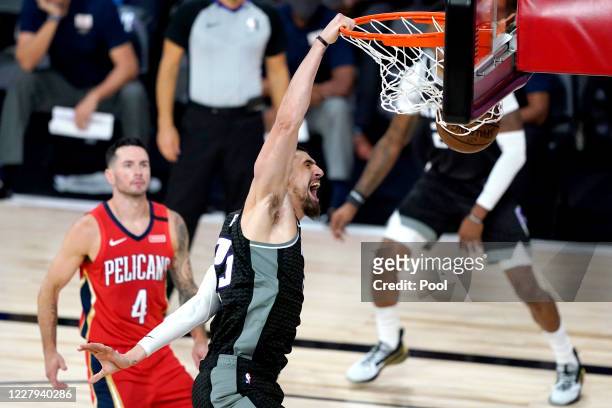 Alex Len of the Sacramento Kings reacts while dunking against the New Orleans Pelicans during the second half of an NBA basketball game at HP Field...