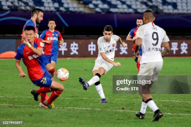 This photo taken on August 6, 2020 shows Shanghai SIPG's Oscar kicking the ball during their Chinese Super League football match with Qingdao...