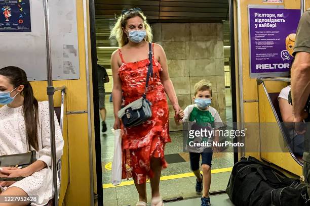 Passenger wear protective face mask inside a subway train amid the outbreak of the coronavirus disease COVID-19 in Kyiv, Ukraine on August 07, 2020