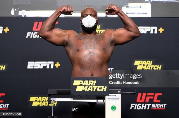 In this handout image provided by UFC, Derrick Lewis poses on the scale during the UFC Fight Night weigh-in at UFC APEX on August 07, 2020 in Las...