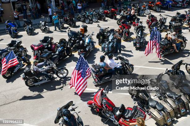 Motorcyclists ride down Main Street during the 80th Annual Sturgis Motorcycle Rally on August 7, 2020 in Sturgis, South Dakota. While the rally...