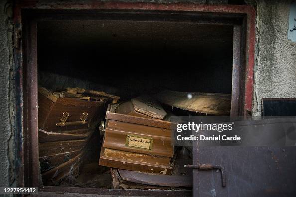 Exploding Coffins Broken coffins, exposed after the burial chamber door was knocked off ...