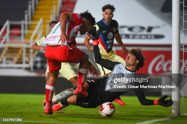 Martin Barragan of Necaxa fights for the ball with Guillermo Ochoa of America during the 3rd round match between Necaxa and America as part of the...