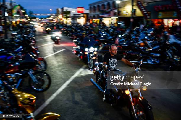 Motorcyclists drive down Main Street during the 80th Annual Sturgis Motorcycle Rally on August 7, 2020 in Sturgis, South Dakota. While the rally...