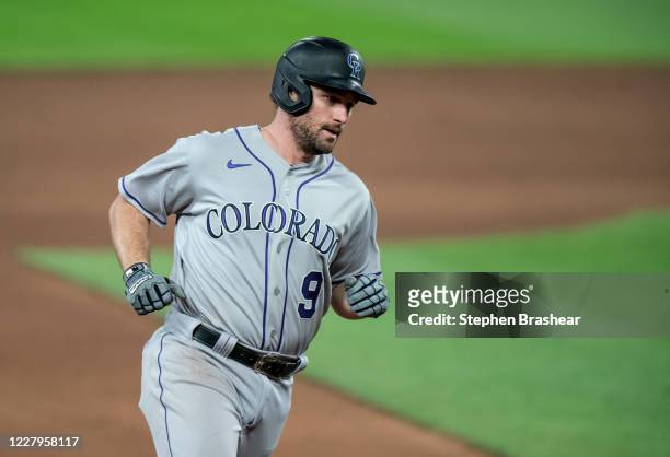 Daniel Murphy of the Colorado Rockies rounds the bases after hitting a two-run home run off relief pitcher Yohan Ramirez of the Seattle Mariners...