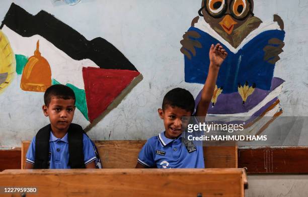Palestinian students attend a class at a school run by the United Nations Relief and Works Agency in Jabalia refugee camp in northern Gaza Strip, on...