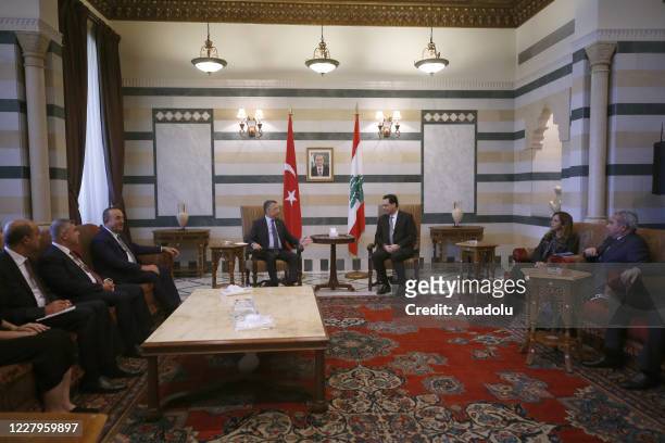 Turkish Vice President Fuat Oktay , accompanied by Turkish Foreign Minister Mevlut Cavusoglu , meets with Prime Minister Hassan Diab in Beirut,...