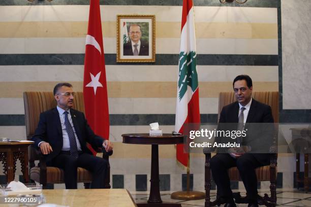 Turkish Vice President Fuat Oktay , accompanied by Turkish Foreign Minister Mevlut Cavusoglu , meets with Prime Minister Hassan Diab in Beirut,...