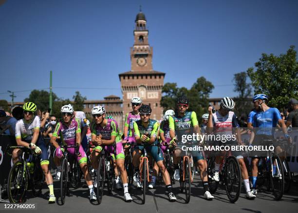 Riders gather in front of Milan's Castello Sforzesco prior to the start of the one-day classic cycling race Milan-San Remo in Milan on August 8, 2020.