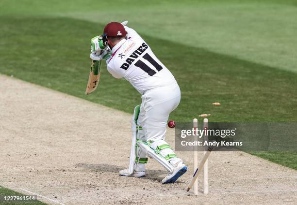 Steven Davies of Somerset is bowled by Ben Sanderson of Northamptonshire during day one of the Bob Willis Trophy match between Northamptonshire and...