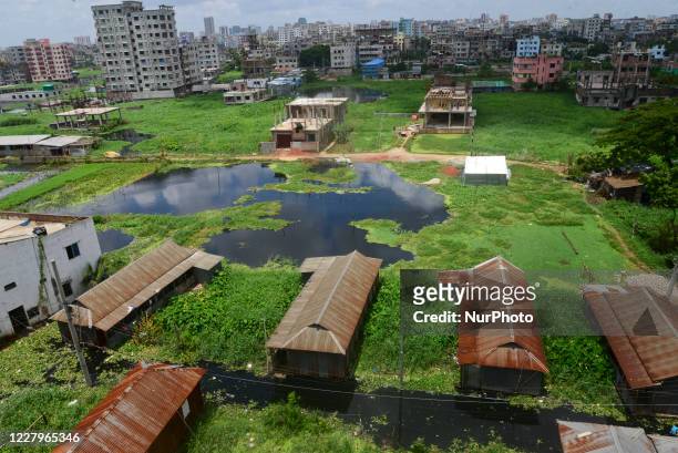 Houses are seen surrounded by the flood water at Lowland area of the Dhaka City in Bangladesh, on August 8, 2020