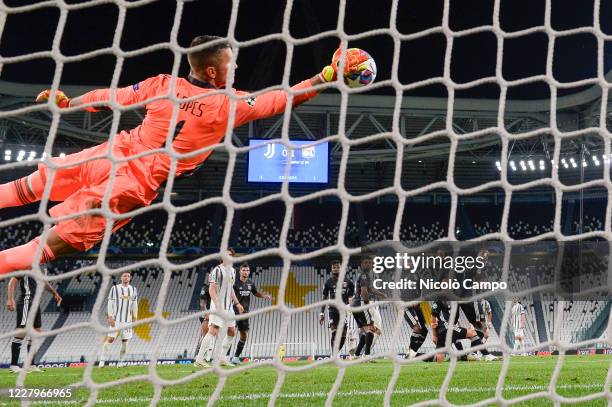 Anthony Lopes of Olympique Lyonnais stretches out to make a save on a free kick by Cristiano Ronaldo of Juventus FC during the UEFA Champions League...