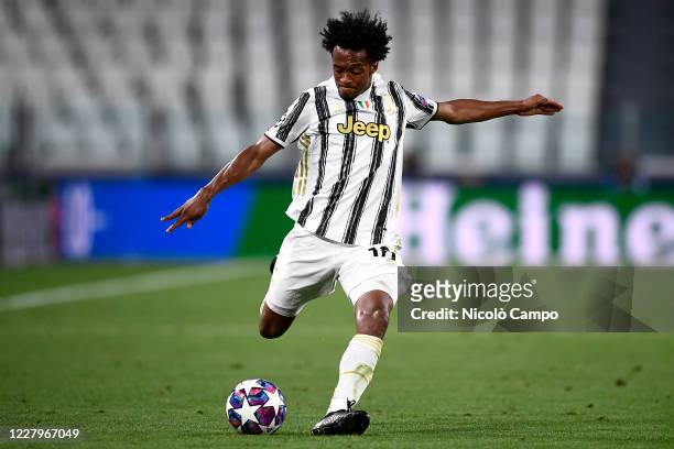 Juan Cuadrado of Juventus FC in action during the UEFA Champions League round of 16 second leg football match between Juventus FC and Olympique...