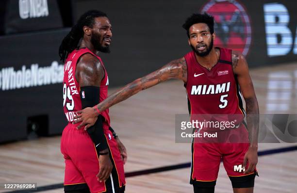 Jae Crowder and Derrick Jones Jr. #5 of the Miami Heat react to a play during the first half of an NBA basketball game against the Phoenix Suns at...