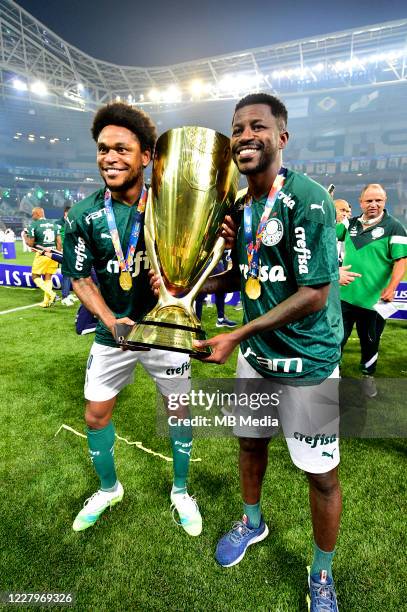 Luiz Adriano and Ramires of Palmeiras holds the trophy while celebrating the victory after the match between Palmeiras and Corinthians as part of the...