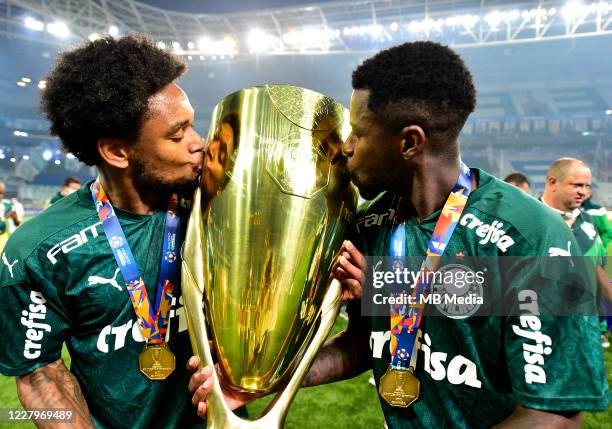 Luiz Adriano and Ramires of Palmeiras holds the trophy while celebrating the victory after the match between Palmeiras and Corinthians as part of the...