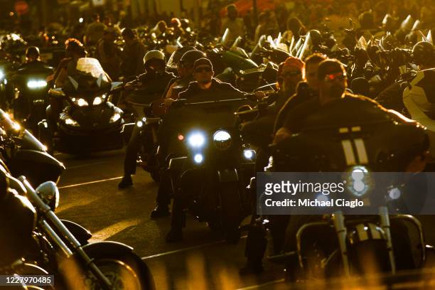 Motorcyclists ride down Main Street during the 80th Annual Sturgis Motorcycle Rally in Sturgis, South Dakota on August 8, 2020. While the rally...