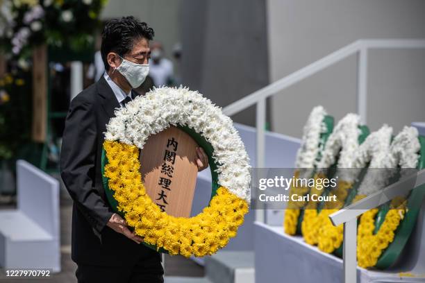 Japan's Prime Minister, Shinzo Abe, lays a wreath at the Peace Statue during the 75th anniversary of the Nagasaki atomic bombing, on August 9, 2020...