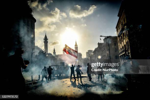 Anti-government protesters take part in a demonstration against the political elites and the government, in Beirut, Lebanon, on August 8, 2020 after...