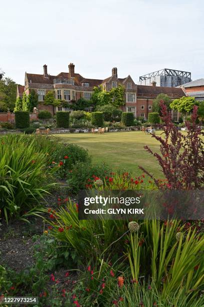 The Manor House and Opera House auditorium at Glyndebourne are seen from the gardens in the summer sunshine in southern England on August 8, 2020.