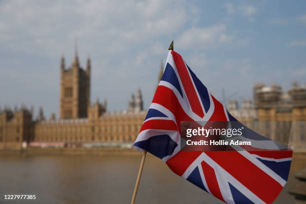 Union Jack flag outside the Houses of Parliament on August 9, 2020 in London, United Kingdom. Southern England saw several days of high temperatures,...
