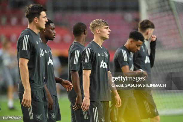 Manchester United's players including Manchester United's English defender Brandon Williams takes part in a training session on the eve of the UEFA...